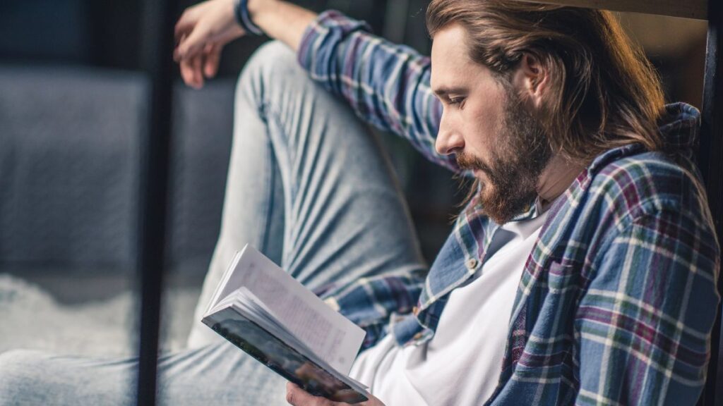 man reading book