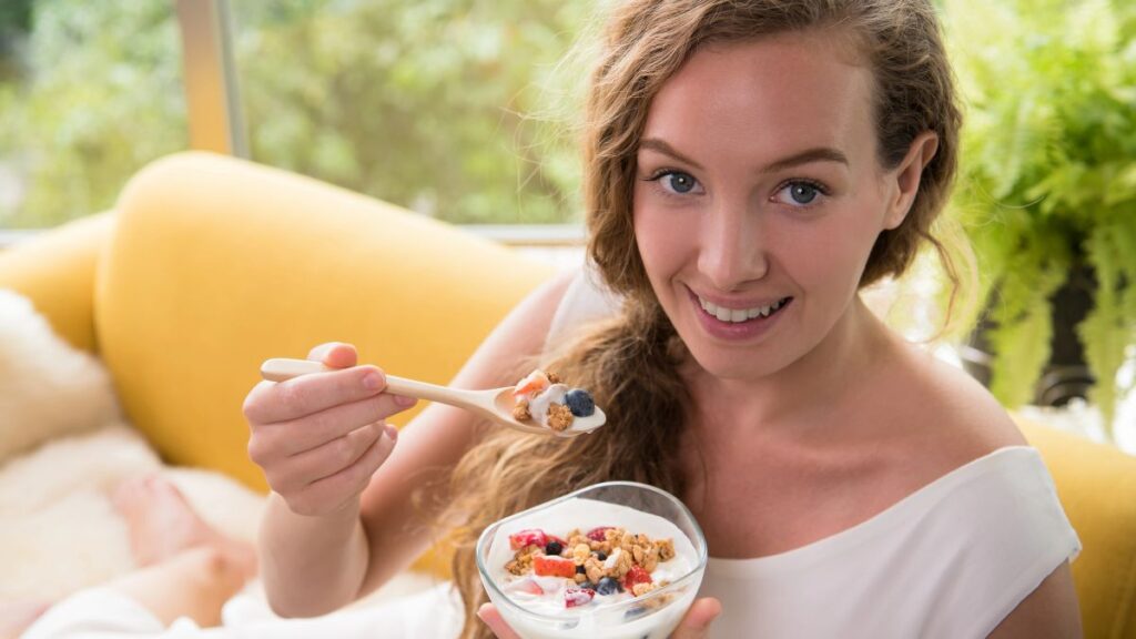 woman eating yogurt