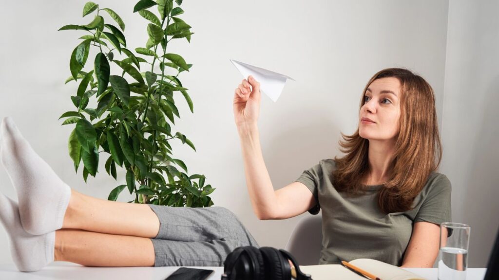 woman flying paper airplane