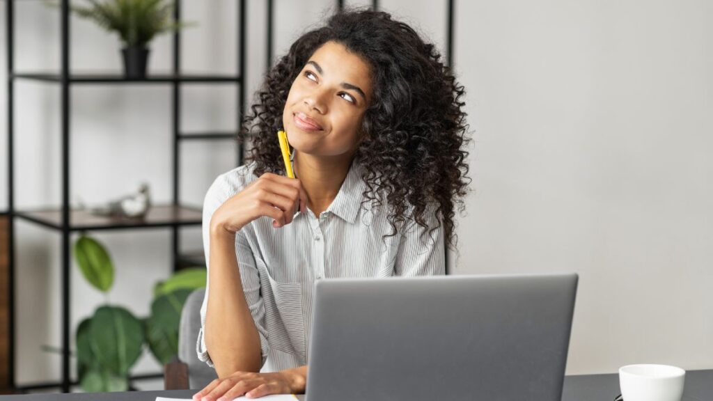 woman thinking at computer