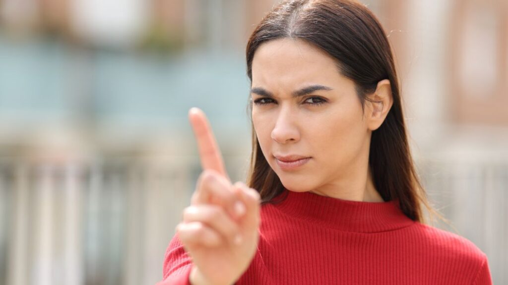 woman with finger up showing no