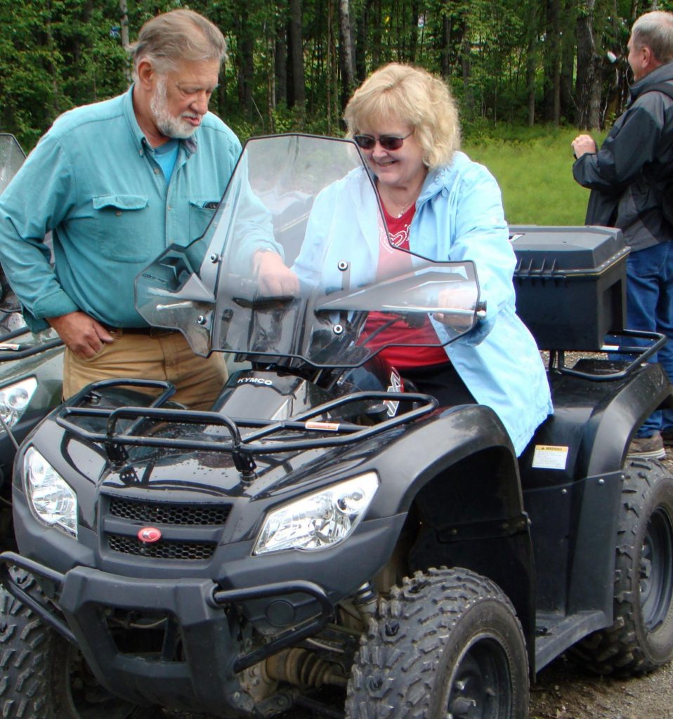 woman on ATV ready to ride into alaska wilderness