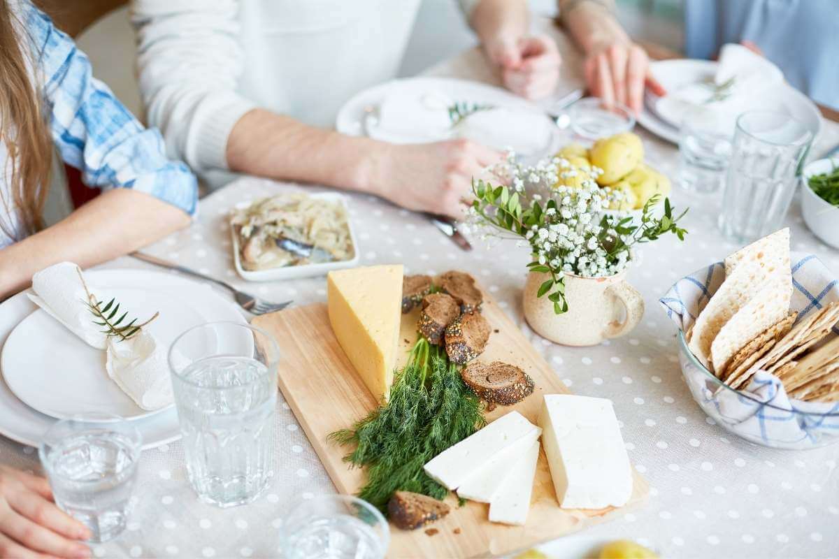 social gathering of friends sharing healthy foods on a table