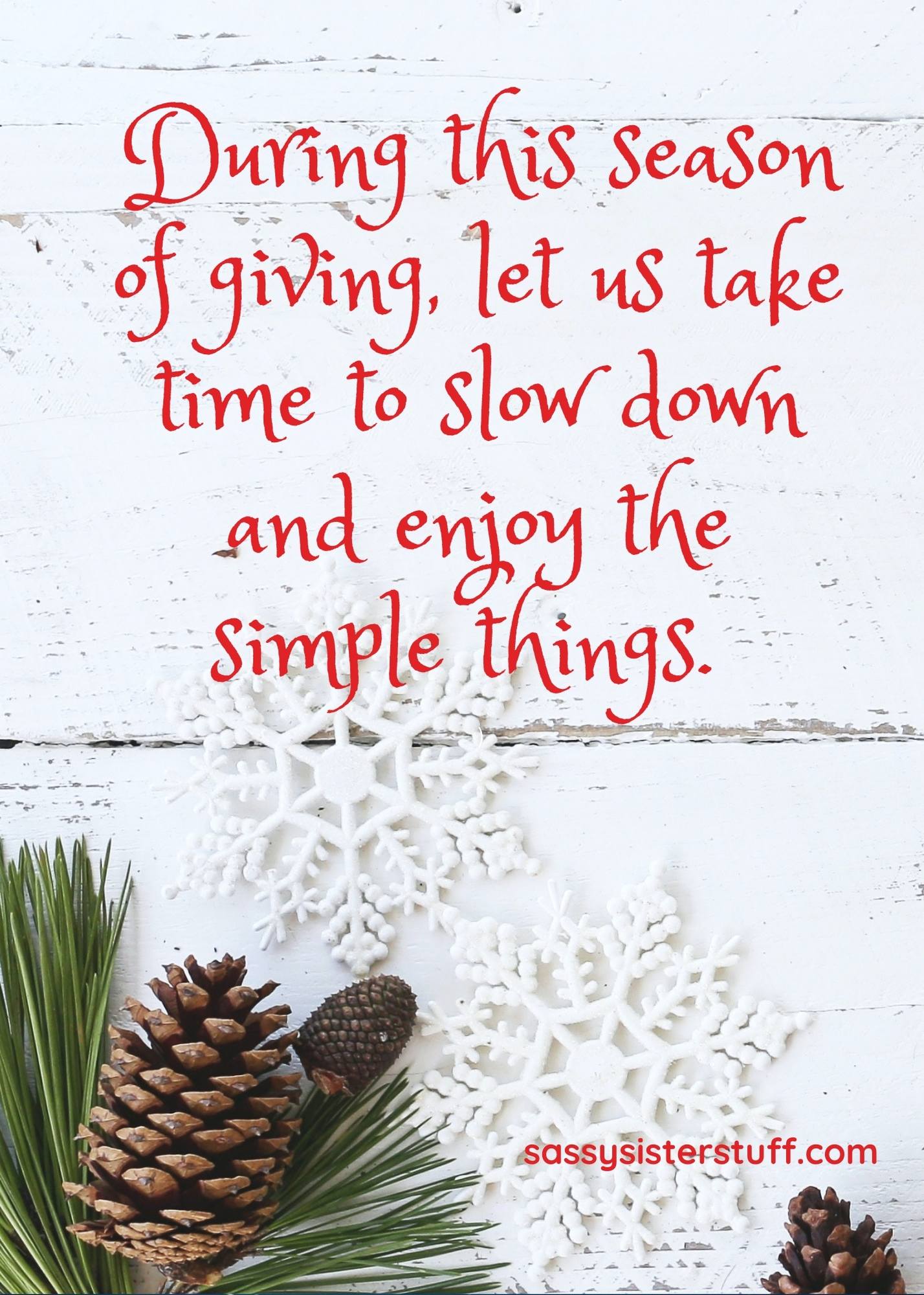 white background christmas quote and holly pinecone and snowflakes