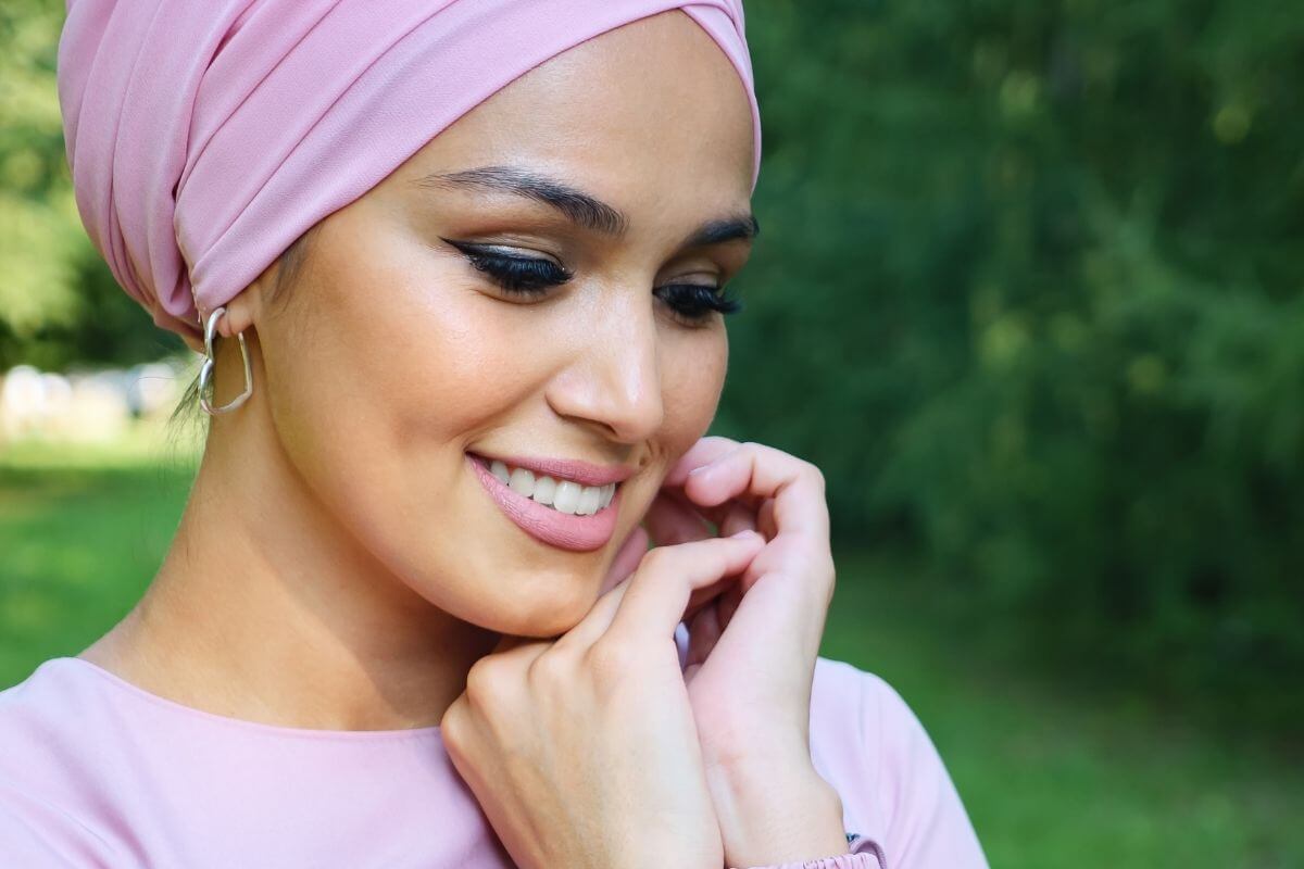 beautilful young woman smiling looking down in a dreamy manner