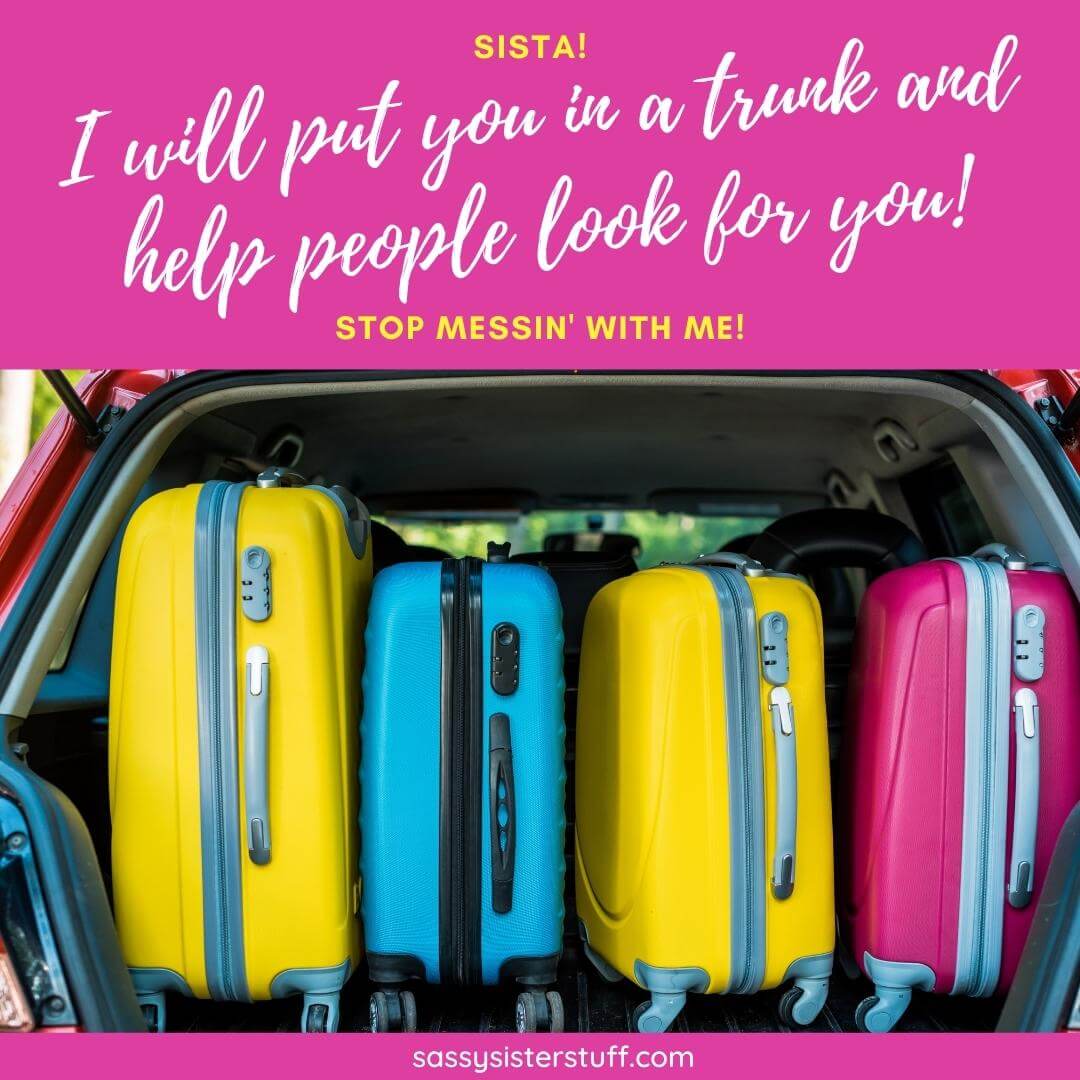 brightly colored luggage in a car trunk with a sassy sister quote