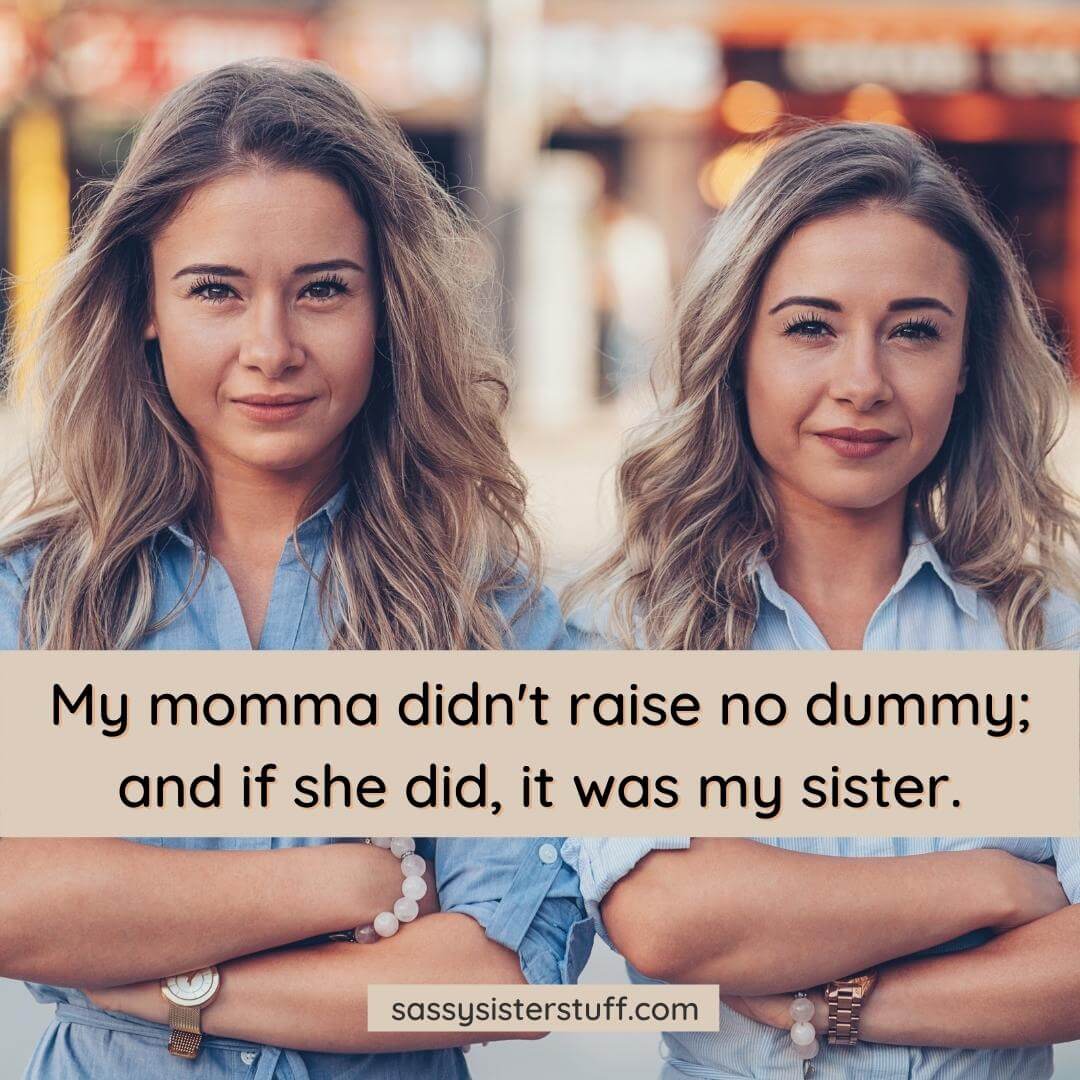 two women looking at the camera smirking with a funny sister quote