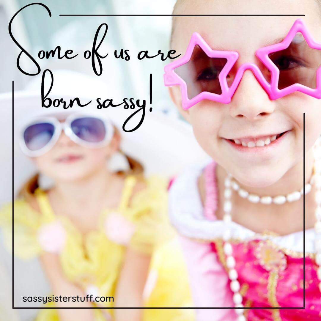 two little girls wearing big plastic colorful glasses and a funny girl quote