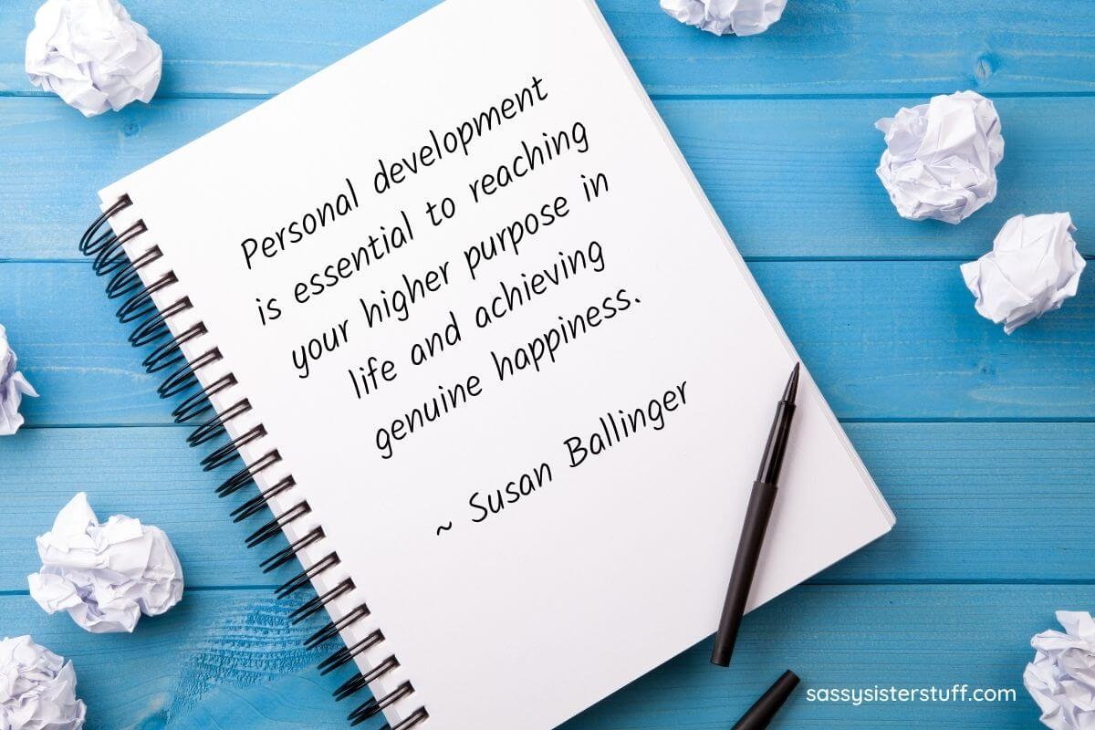 personal development quote about higher purpose and happiness written in a notebook