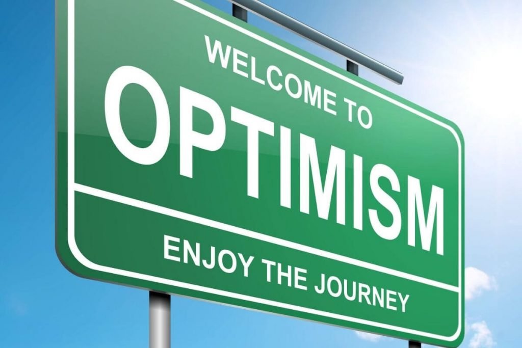 a highway sign that says welcome to optimism