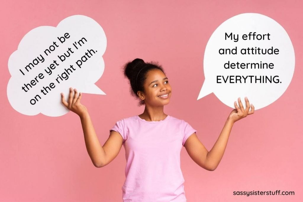 happy female teenagers holds two thought bubbles with mindset quotes