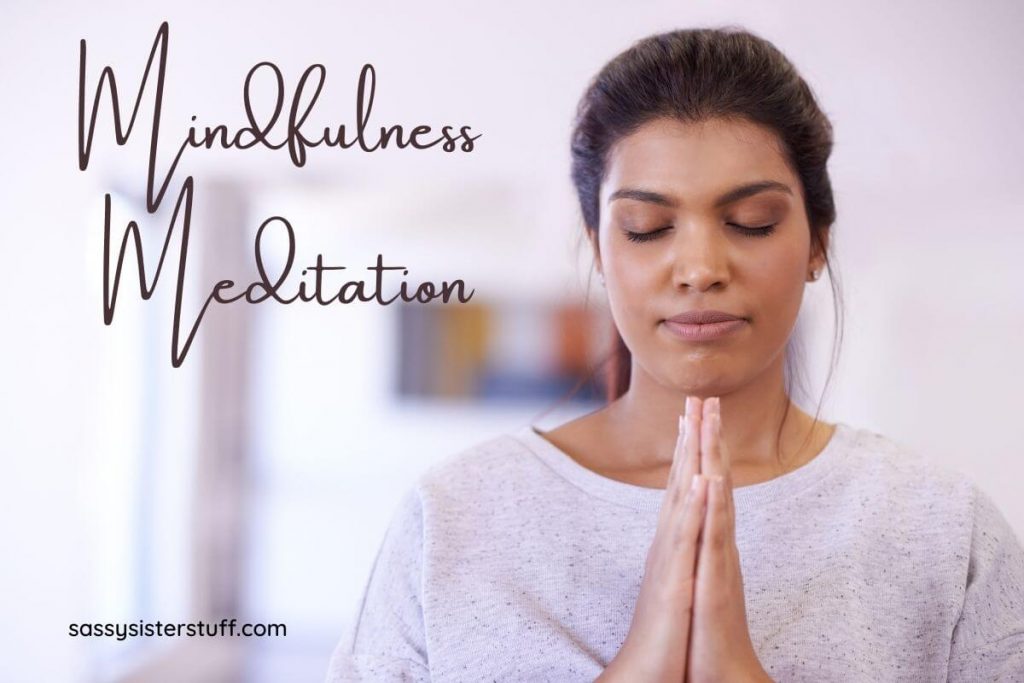 young woman with hands together in prayer for mindfulness meditation