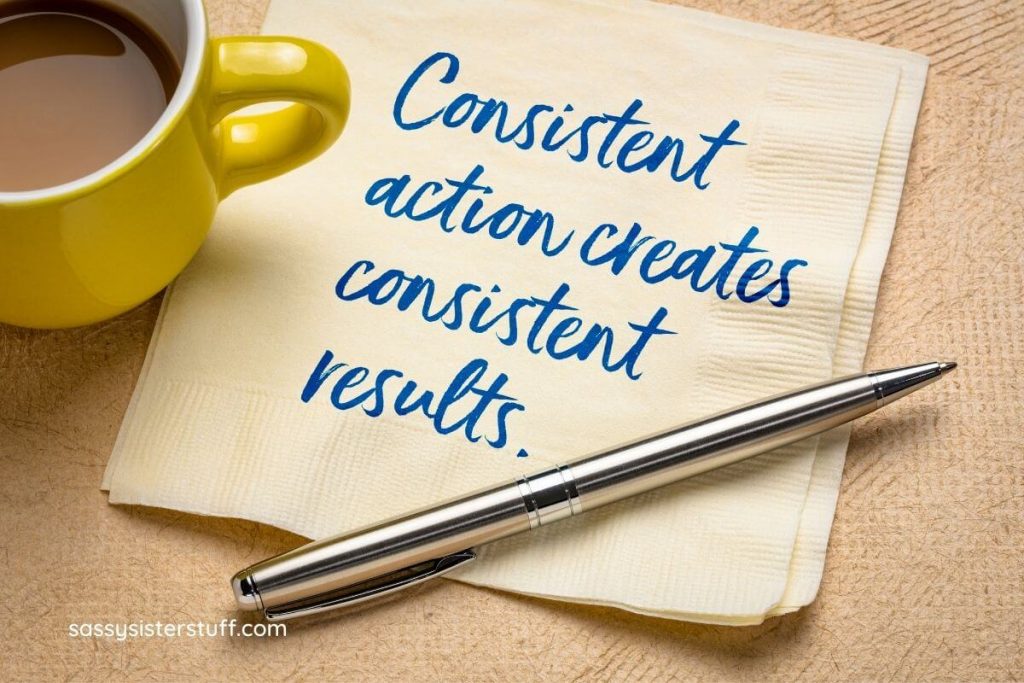 consistent action creates consistent results written on a napkin sitting next to a cup of coffee