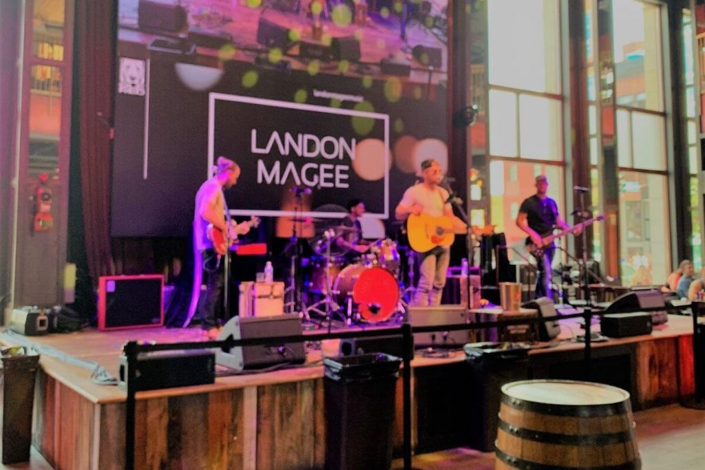 band playing on a wooden stage in a Nashville restaurant