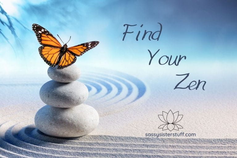 three white stones stacked on white sand with a yellow butterfly on top and find your zen written next to the image