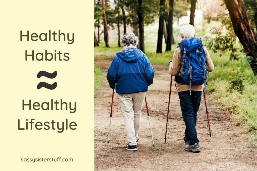 an older couple walking on a path in the forest showing one of 10 ways to improve your physical health