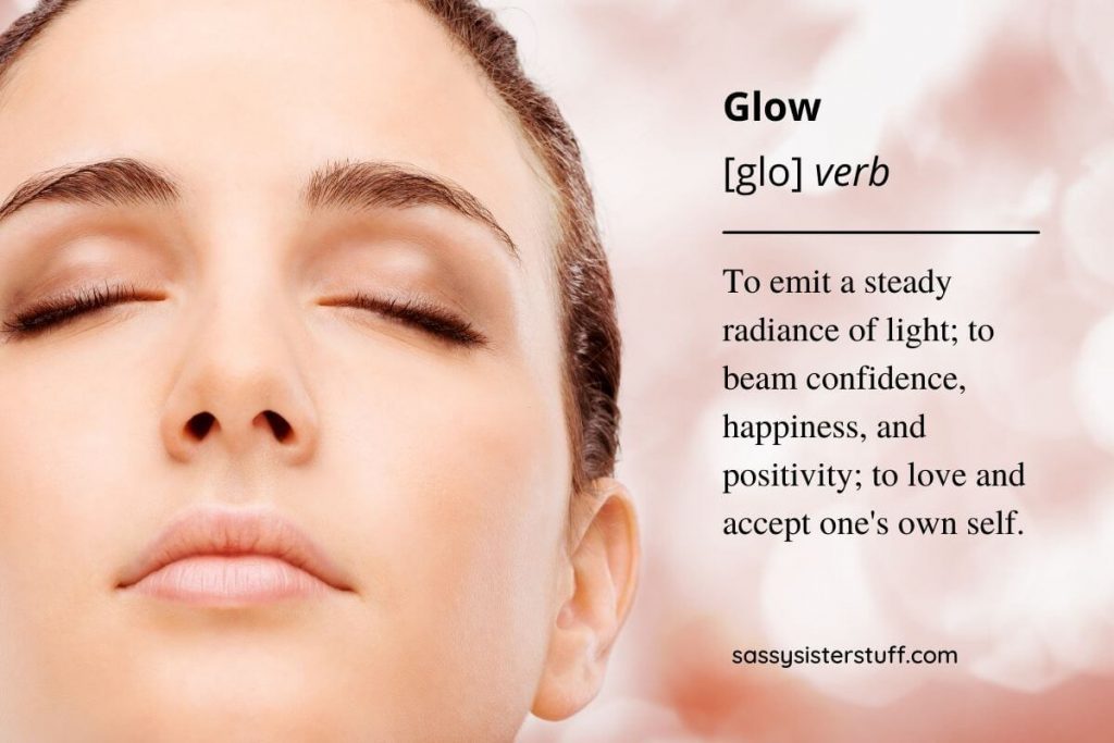 a close up photo of a beautiful woman's face with her eyes closed and a beautiful definition of the word glow