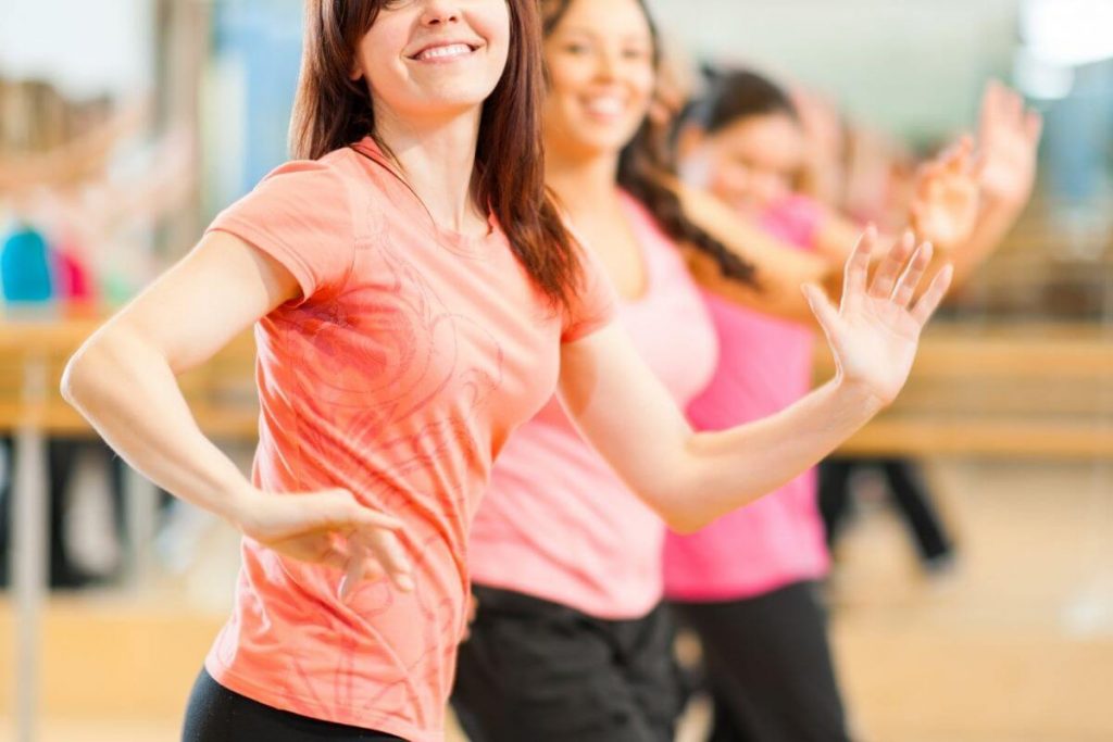 ladies dancing to show how to improve social wellness