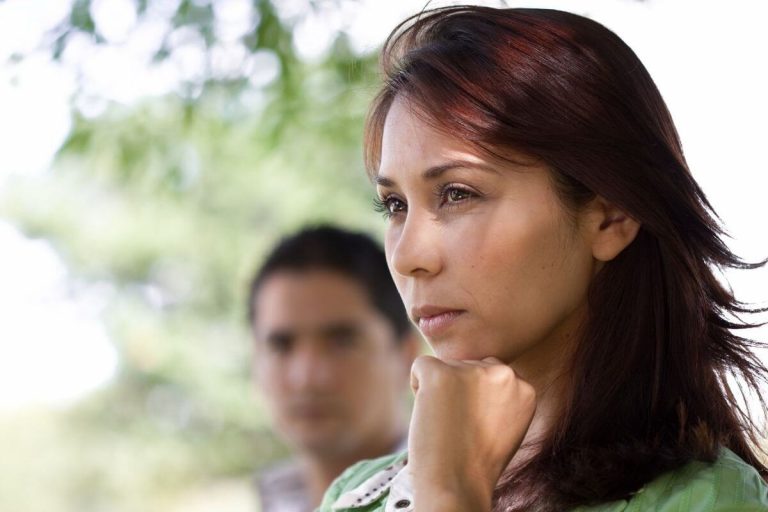 a woman stares into space with a look of frustration on her face as she thinks about the struggles of life