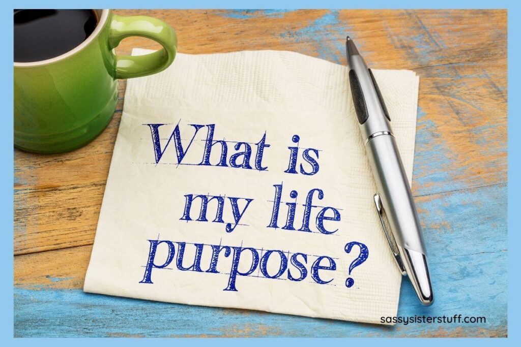 a green mug and coffee with a napkin and pen and the question that says what is my life purpose