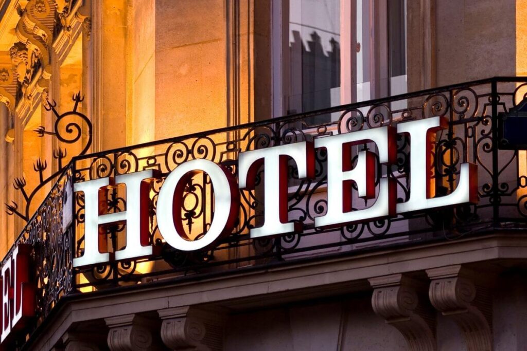 image of a hotel balcony with large letters that say HOTEL on the side of the balcony