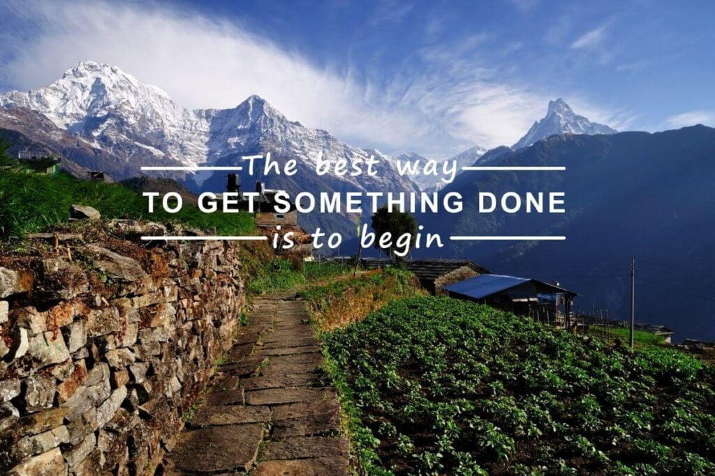 snow capped mountains against a blue sky with a rock path and green hills in front of the mountains and a stages of life quote that says the best way to get something done is to begin