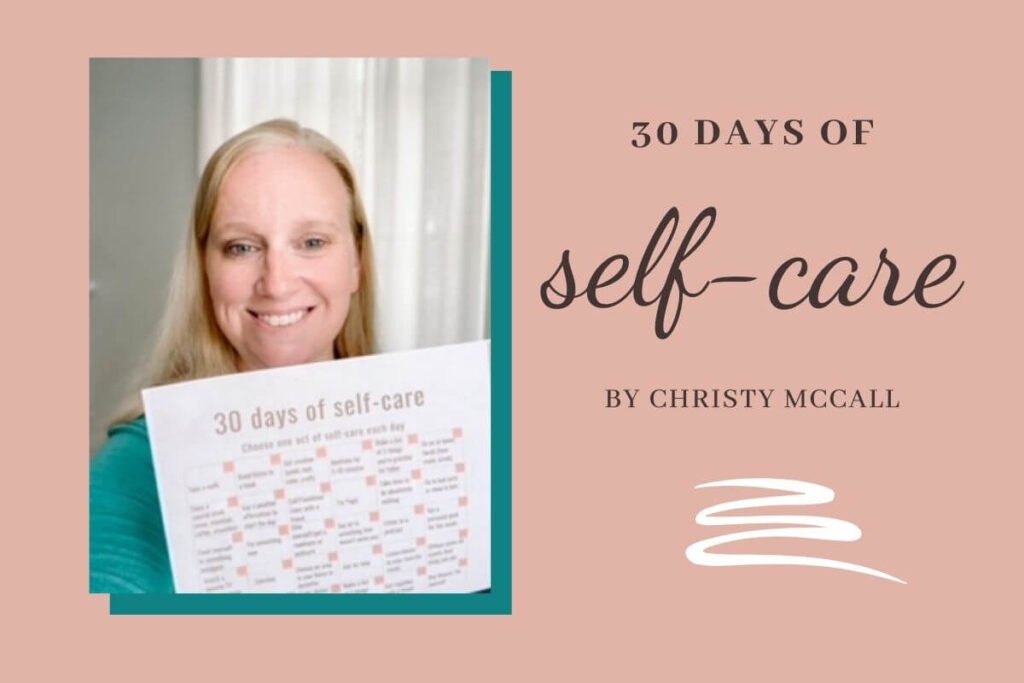 author of the 30 day self-care challenge holding a copy of the challenge and smiling at the camera