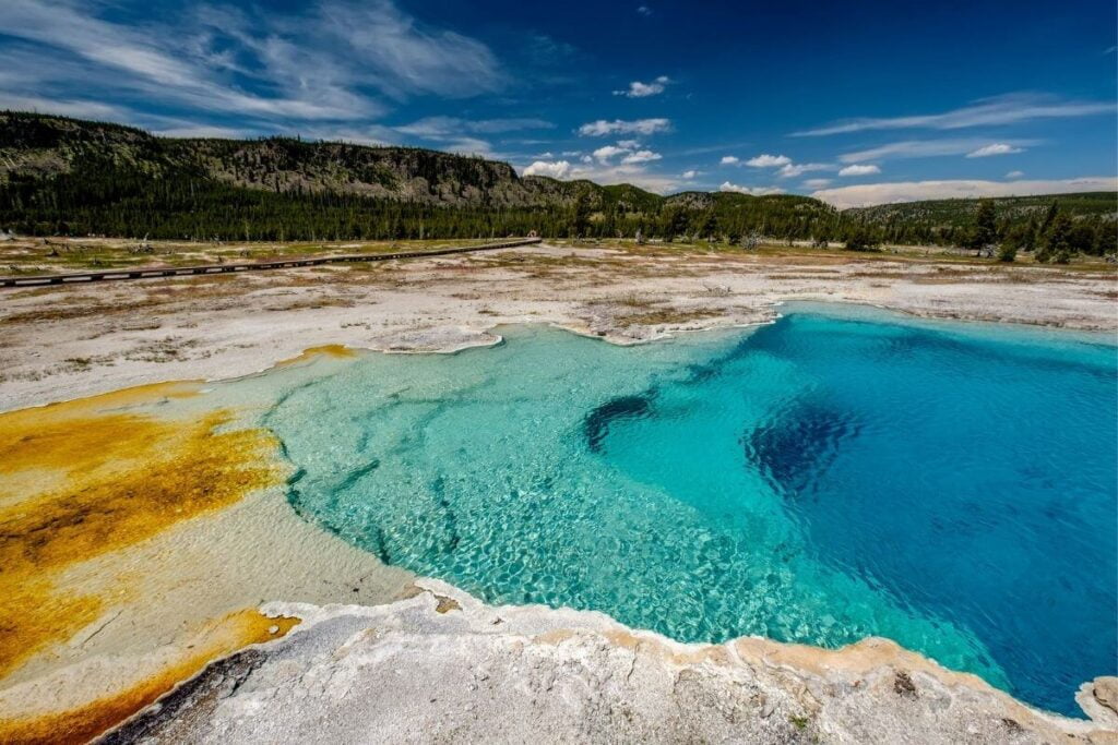 an image of the Sapphire Pool geyser in yellowstone national park one of the most popular adventurous bucket list trips in america