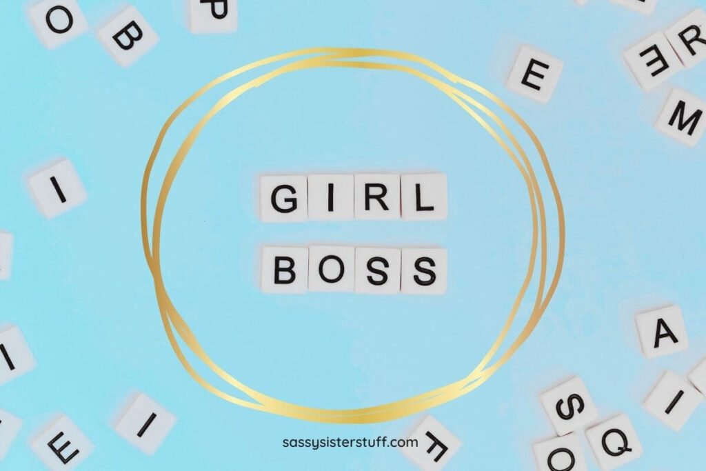 pale blue background with scrabble style letter tiles that spell out girl boss