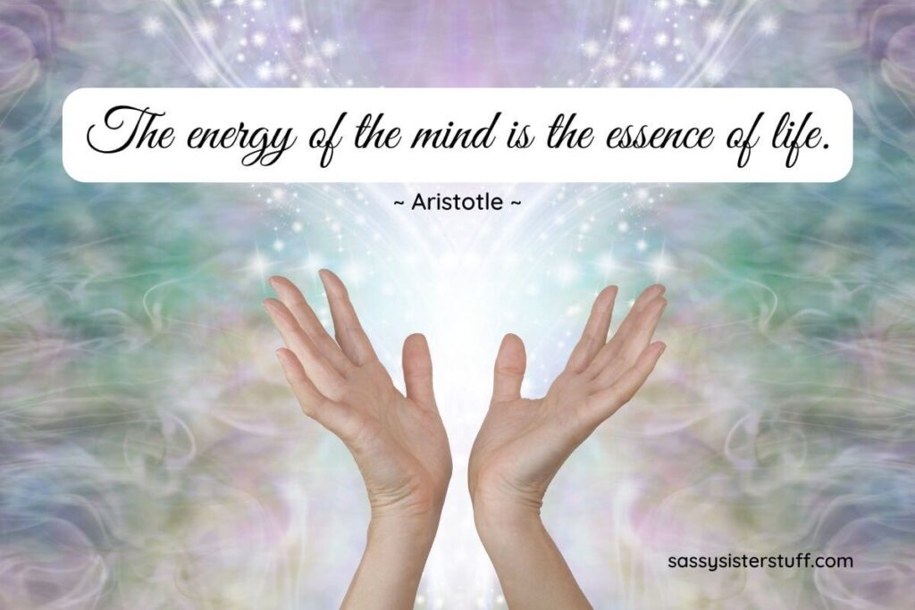 mystical wavy background in soft pastel shades and starbursts appearing to be released into the air by a pair of open hands and an inspirational quote about energy and life