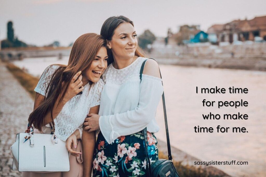 two happy young women walk along the edge of a canal clearly showing that people make time for that they want in life