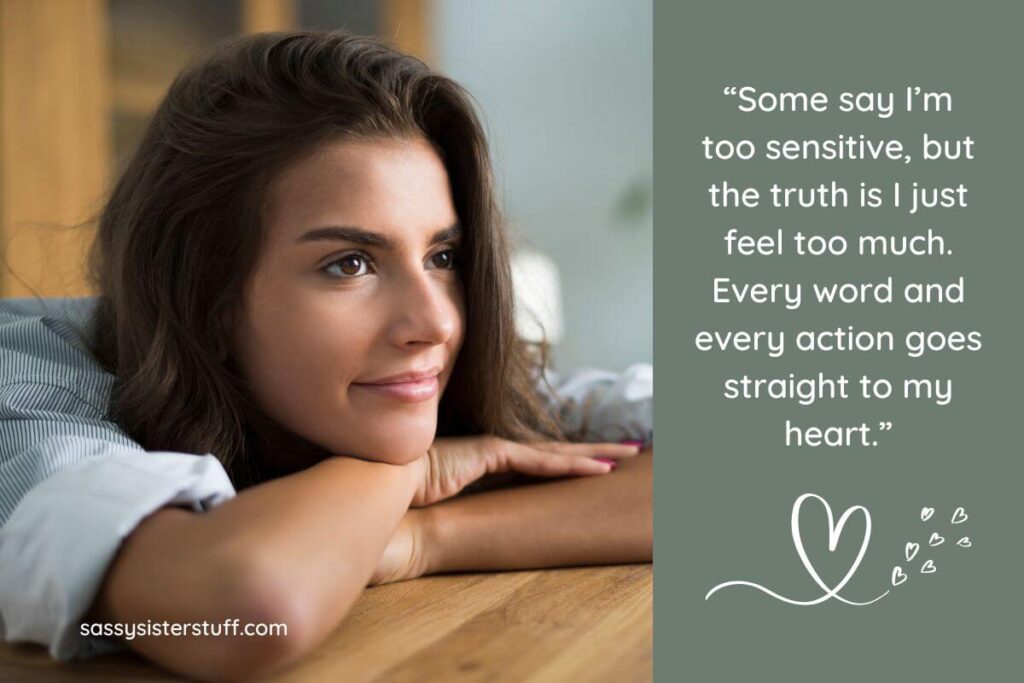 a reflective young woman rests her chin on her crossed arms on a desk and looks out the window thinking about how to respond when someone says you're too sensitive plus an encouraging quote on an overlay