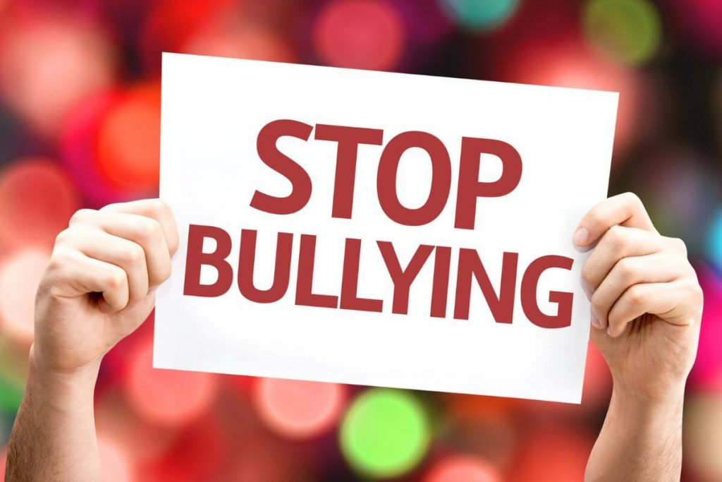 bullying survivors create a stop bullying sign