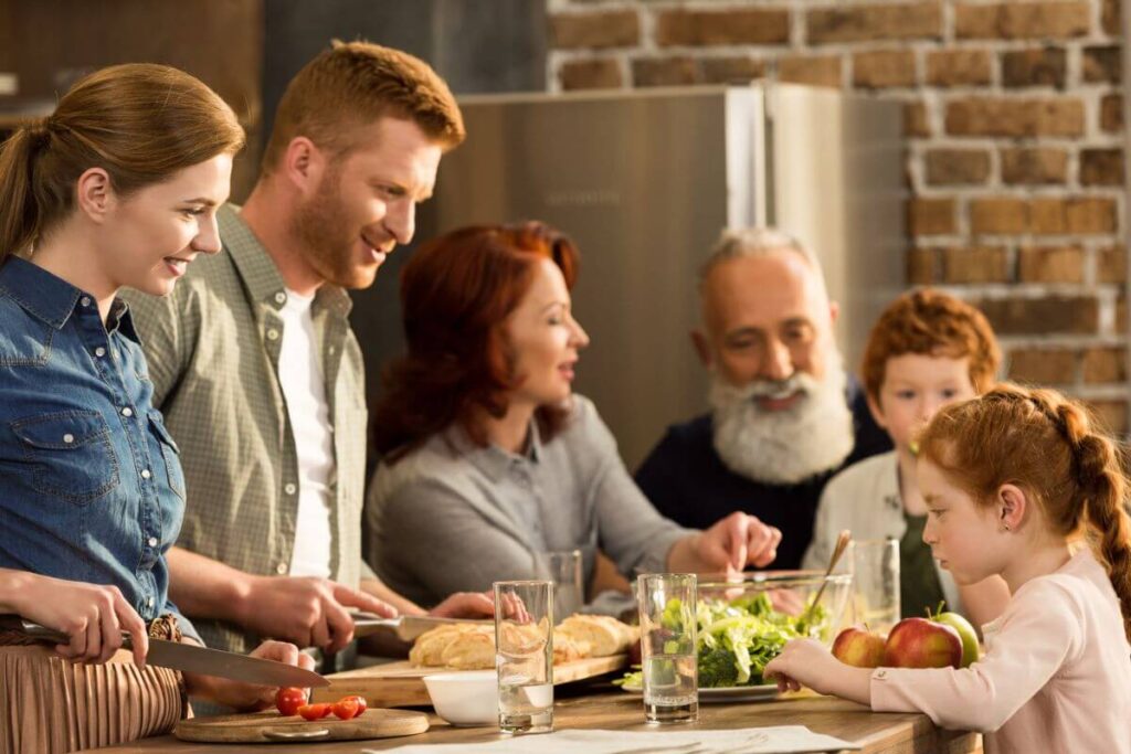 multigenerational family of 6 gathers for dinner to avoid grandparent alienation