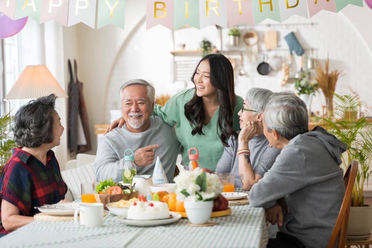 multigenerational Asian family celebrating a birthday at home