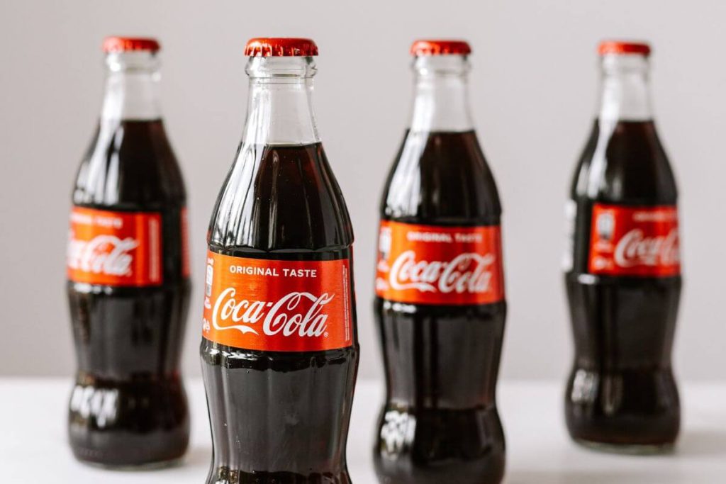 four bottles of Coca Cola represent just one of many foods to avoid after turning 60