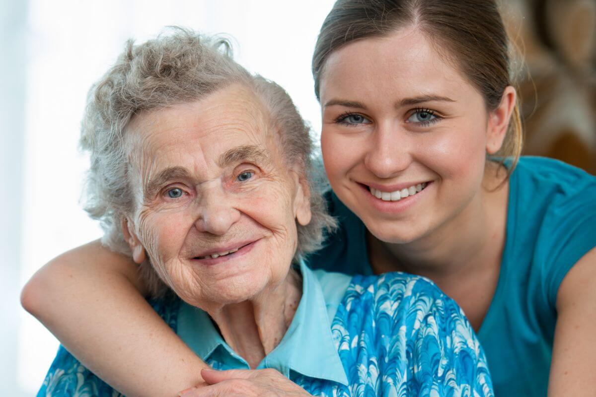 lovely granddaughter poses with her grandmother with big smiles