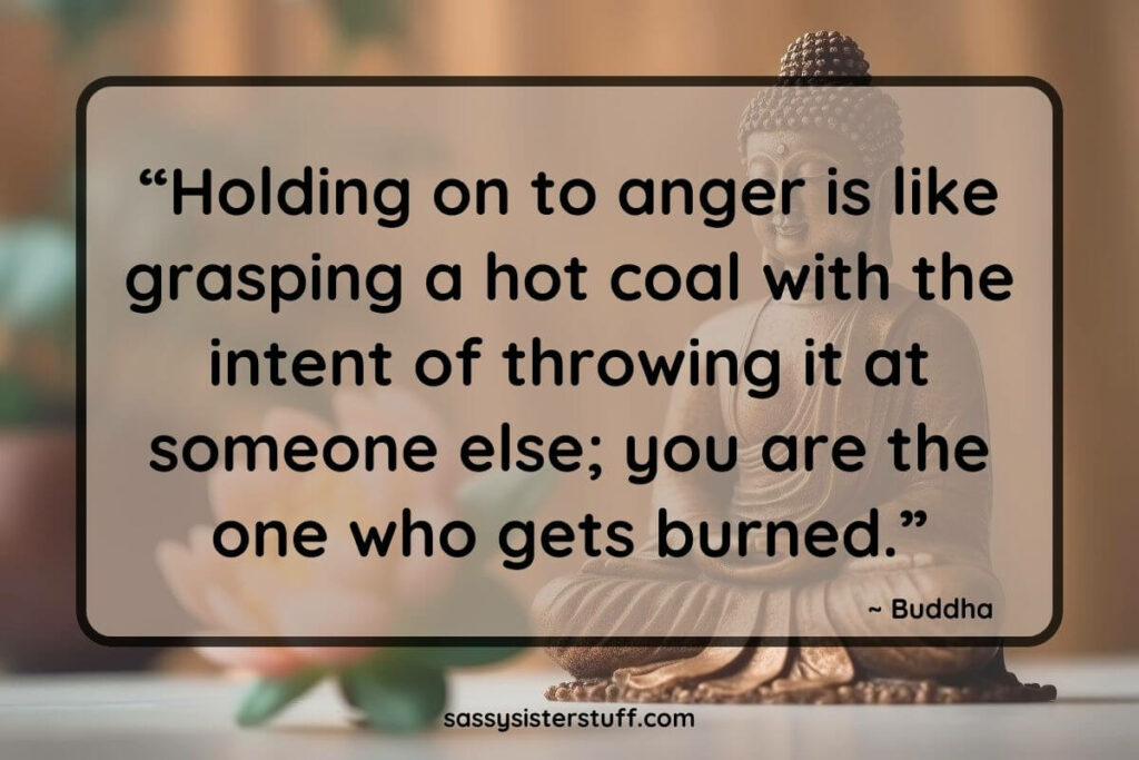 Buddha statue with text overlay quote that reads: Holding on to anger is like grasping a hot coal with the intent of throwing it at someone else; you are the one who gets burned.