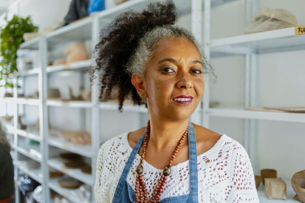 happy black woman wears an apron to do what she loves