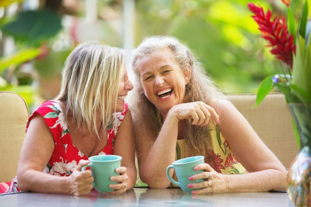 two girlfriends discuss the joys of friendship over 50