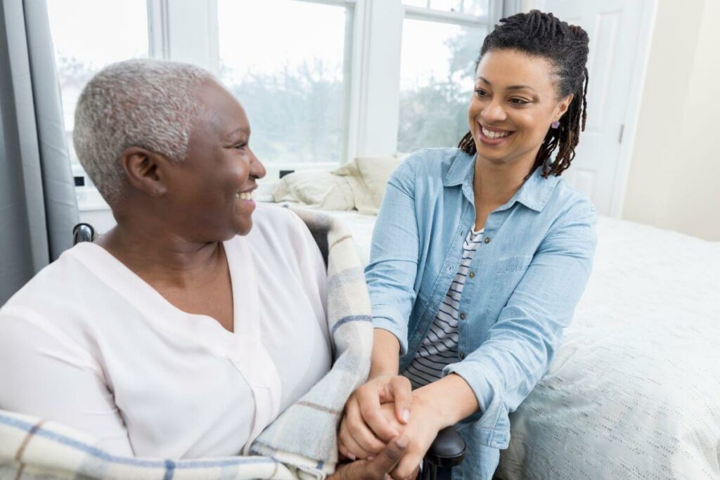 adult child compassionately talking with her mom using strategies to avoid arguing with elderly parents