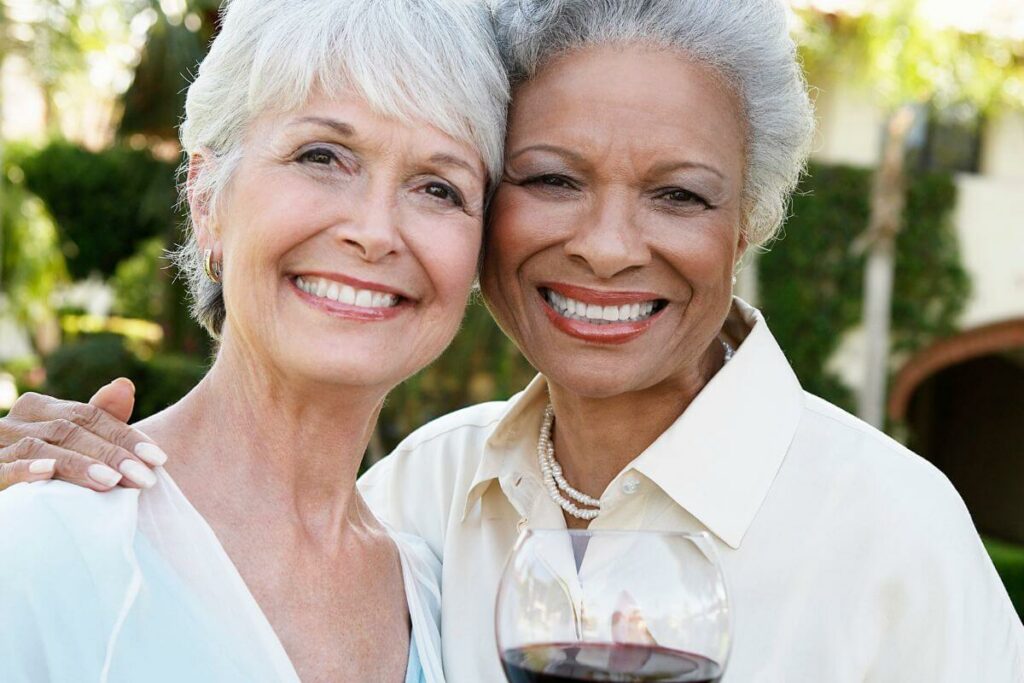 two middle aged beautiful women embrace for a photo after reading meaningful friendship quotes