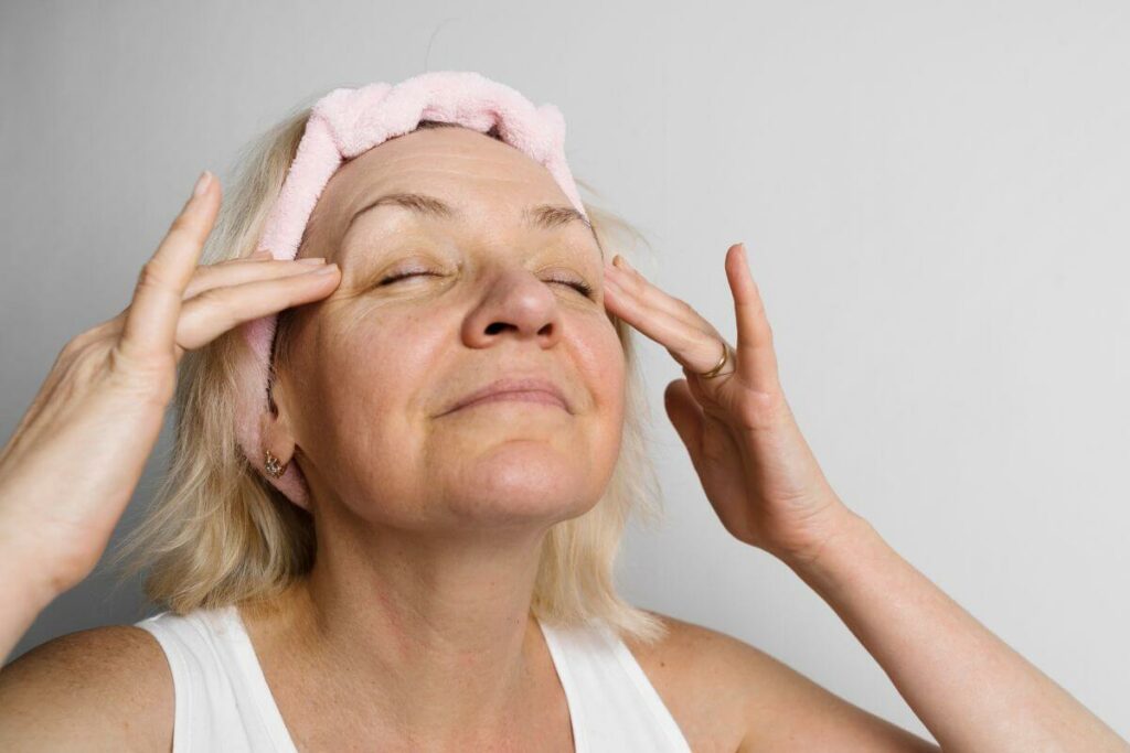 middle aged woman uses her Sunday to do a facial and refresh for the week.