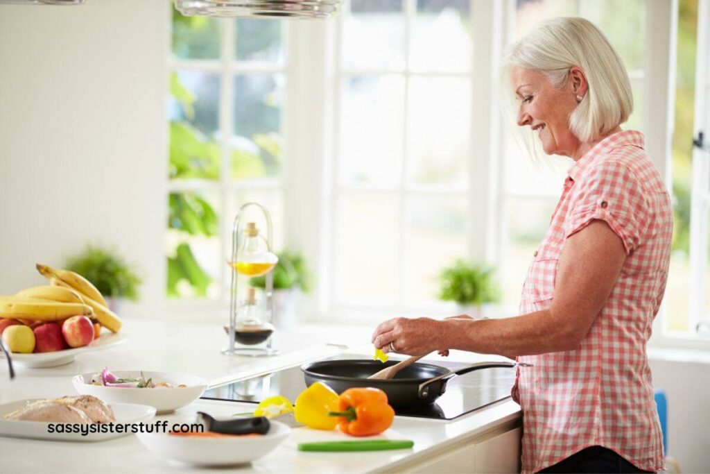 a middle aged woman develops habits for lasting wellness by preparing a healthy meal.