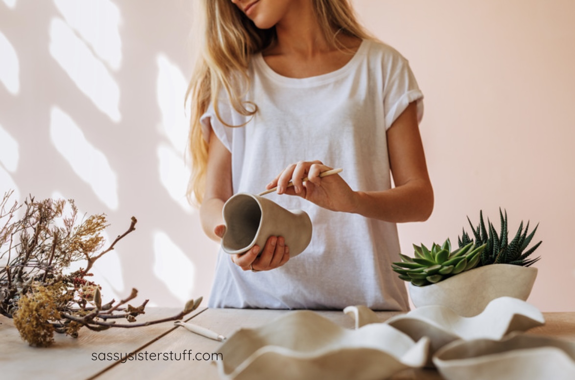 Woman working with plants because she wants to turn her passion into a financial side hustle.