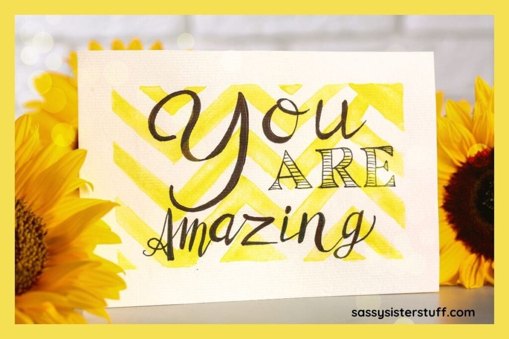 yellow daisies and a sign that says You are Amazing.