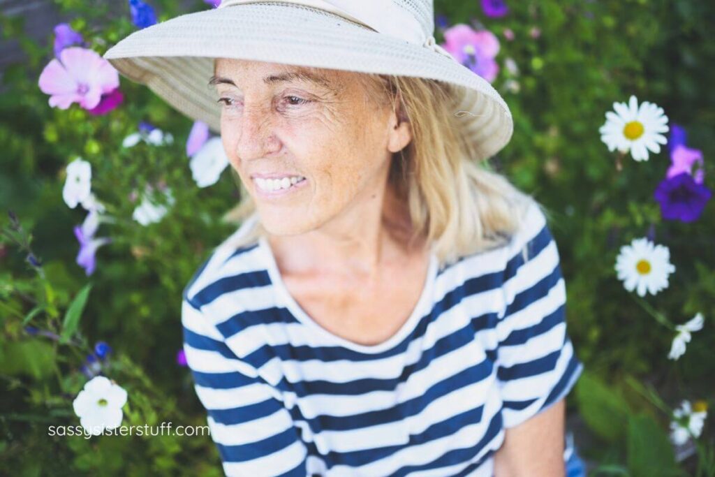 middle aged woman working in her garden to get fresh air and exercise