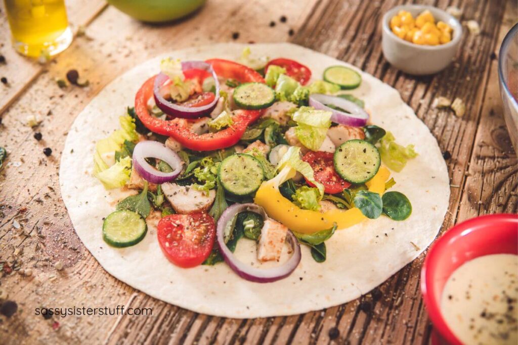 top view of a healthy salad with vegetables and chicken