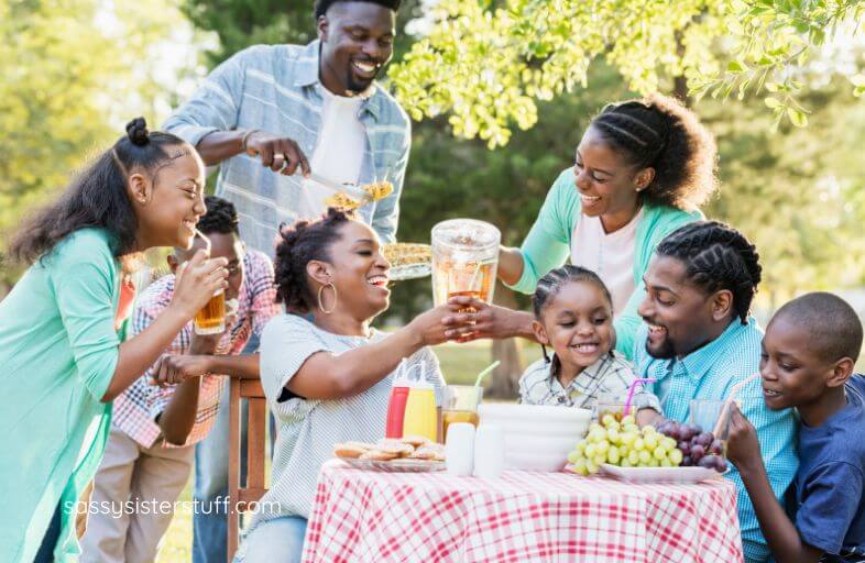 multi-generataional picnic in a park.