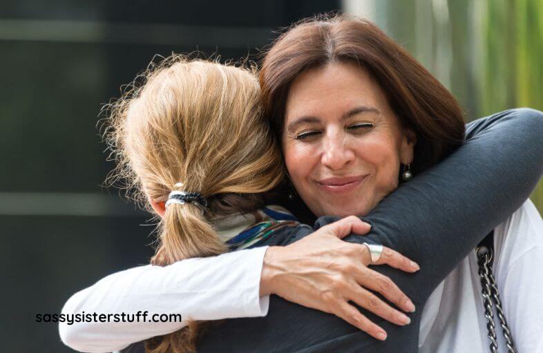 a middle aged mom says goodbye to her daughter as she leaves her at college and enters her empty nest era.